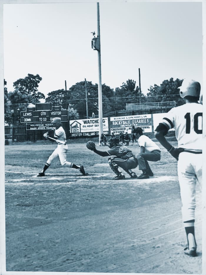 Edmead swinging away, as Cruz waits on deck.